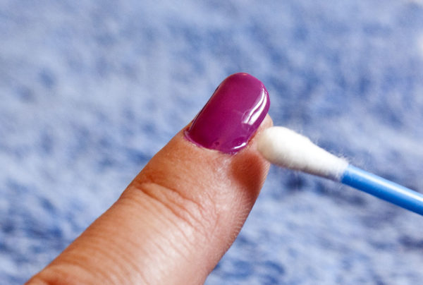 Picture of woman wiping off excess polish