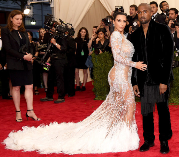 Mr and Mrs West were wearing Roberto Cavalli. Kim said that her dress was inspired by Cher's Met Gala look in 1971.