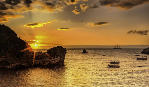Picture of sailing vessel at sunrise