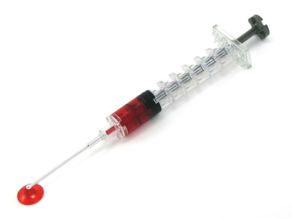 Picture of a life-size lego syringe with blood