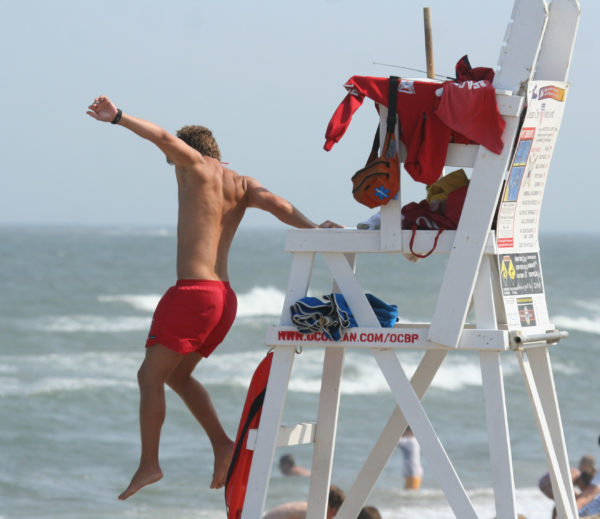 Lifeguard jumping into action
