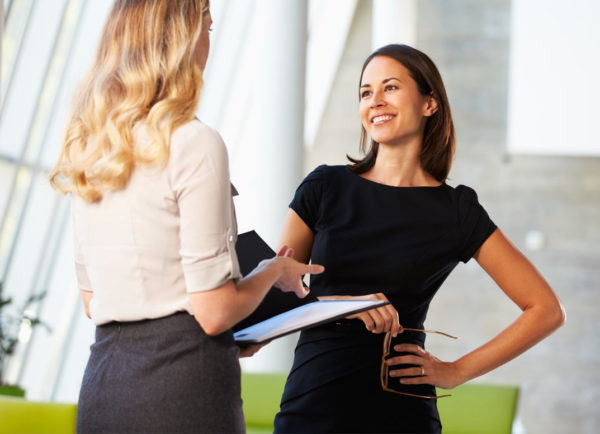 Picture of woman giving project to another woman