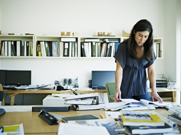 Female architect working at desk in an office.