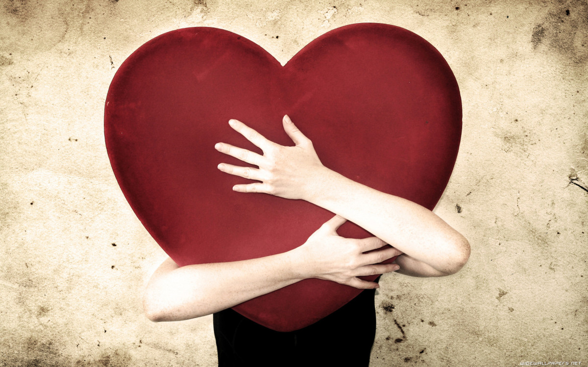 woman holding huge heart