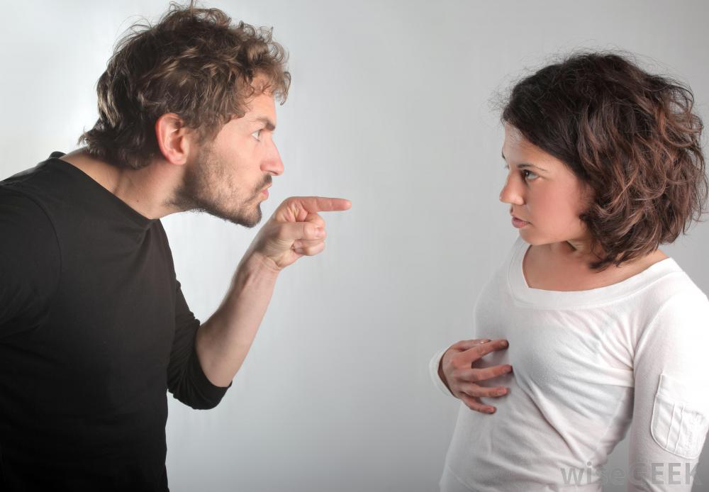 Man pointing at woman