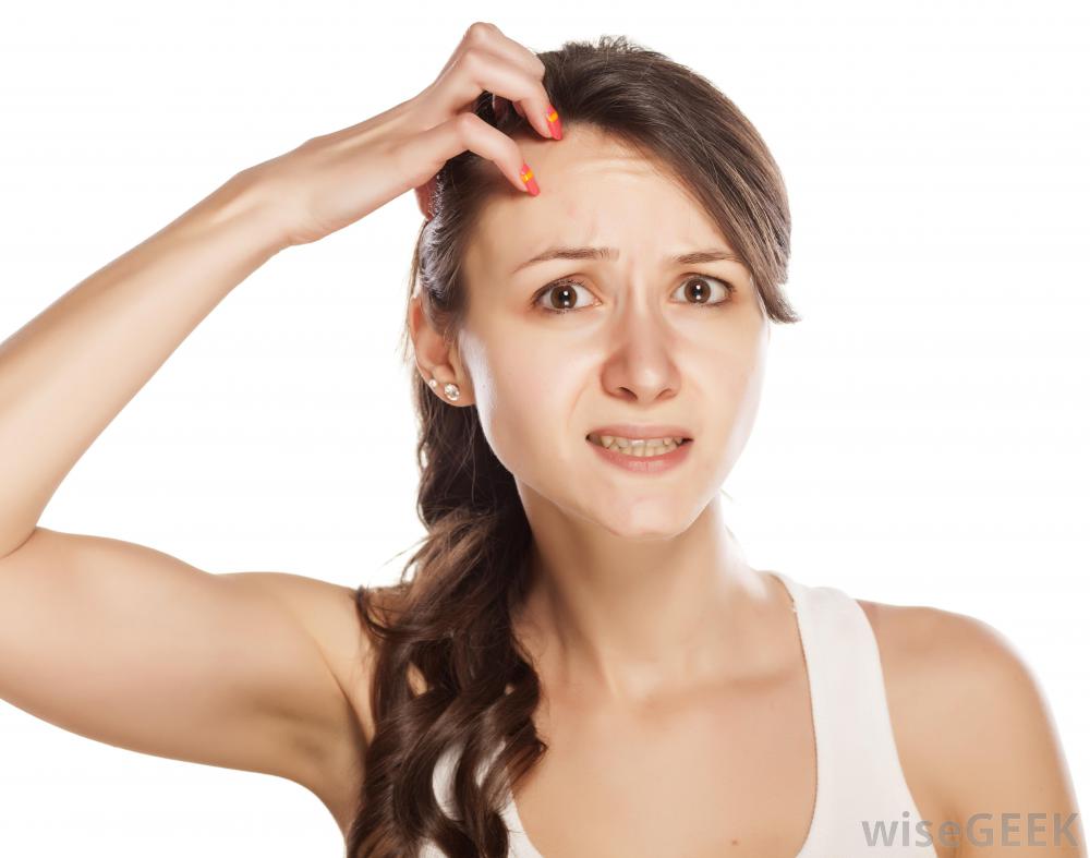 Woman scratching head
